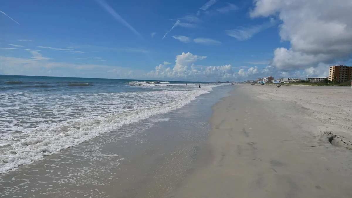 Surf lines breaking along the shoreline