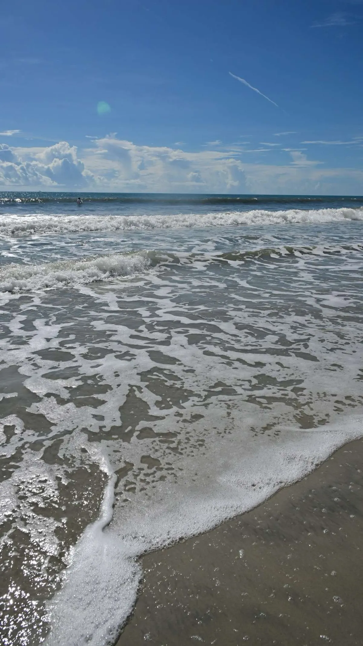 Atlantic foam drawing back over the sand