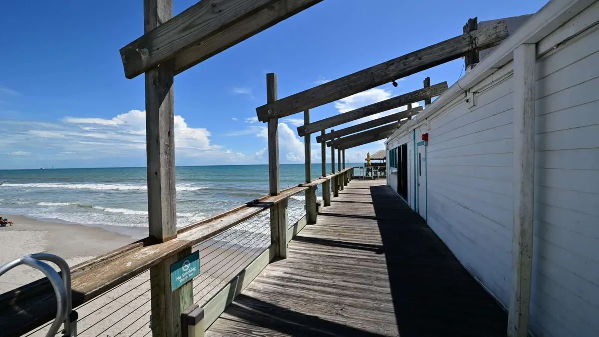 Weathered pier decking above the water