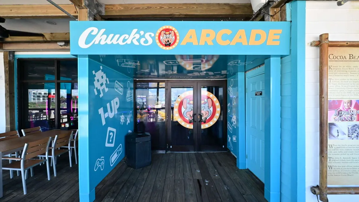 The bright blue front of a beachside arcade