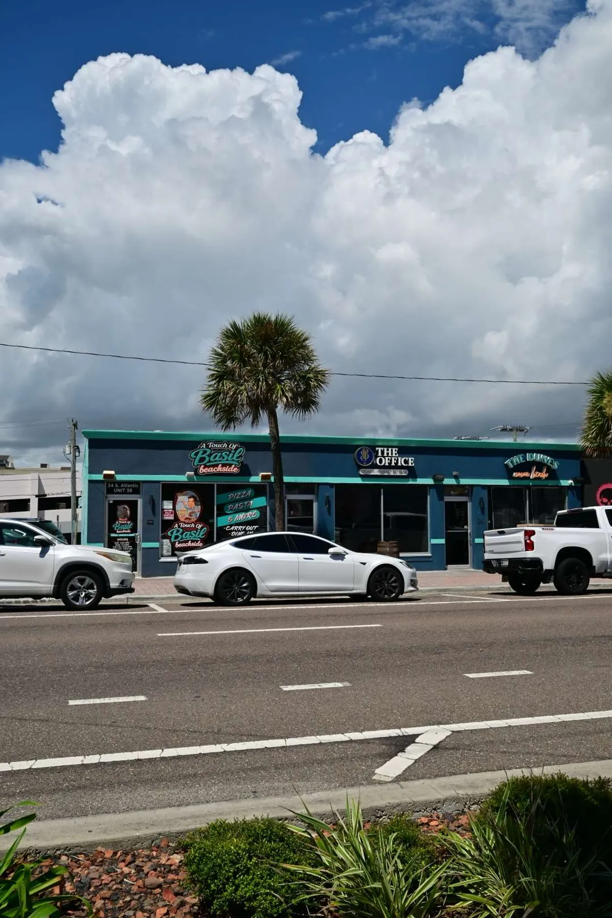 A quiet seaside street corner on a weekday morning
