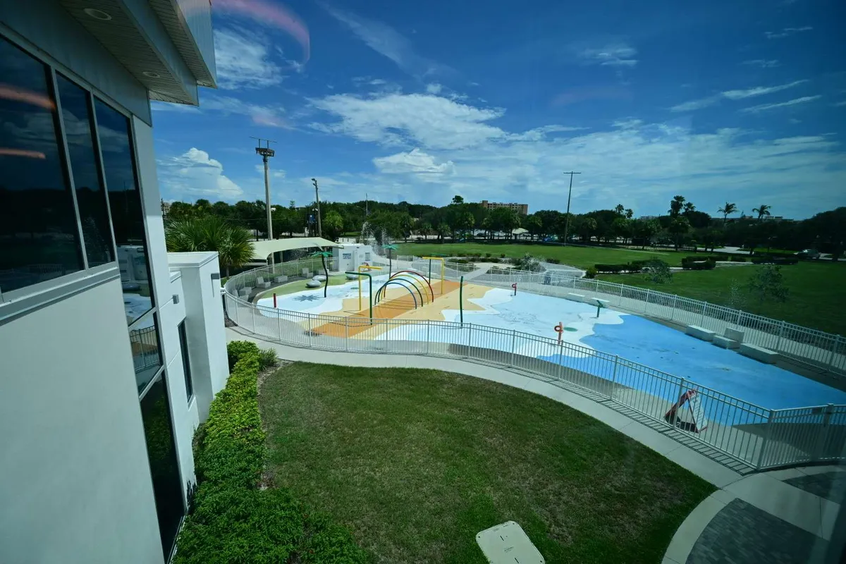 Water-park slides curling beside the palms